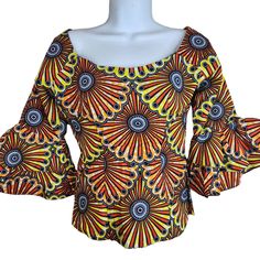 Vintage 90s African Print Top Blouse S Orange Yellow Flounce Trumpet Sleeve Beautifully hand made Rear zipper closure Fitted trumpet sleeve Square neck line, can be worn off shoulder or not There is a lot of fabric inside to let out seams if needed. Measurements: Bust: 15" Shoulder to hem, length: 20.5" Sleeve length: 16.5" Fitted Bell Sleeve Cotton Tops, Vintage Fitted Bell Sleeve Tops, Yellow Fitted Off-shoulder Tops, Fitted Off-shoulder Yellow Tops, African Print Tops Blouses, African Print Top, African Print Tops, Jaune Orange, Trumpet Sleeve