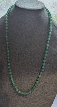 "Chinese Jade Bead Necklace * HALLMARKS Unmarked. * MEASUREMENTS 8mm beads with overall length of 28\". * WEIGHT 61.92 Grams *  MATERIALS Jade, silk cording. * CONDITION In very good to excellent condition, please use pictures as part of description. Art Deco Chinese Jade bead necklace. Beads are strung on hand knotted silk cord and this is the type of necklace with no clasp and it slips over the head. Necklace will arrive gift boxed. Thank you for stopping by!!" Luxury Jade Beaded Necklaces With Natural Stones, Luxury Jade Beaded Necklace With Gemstone Beads, Jade Beaded Necklace With Polished Beads, Traditional Green Necklaces With 8mm Beads, Traditional Green Necklace With 8mm Beads, Green Beaded Necklaces With 8mm Round Beads, Classic Green Beaded Necklaces With Round Beads, Round Green Beaded Necklaces With 8mm Beads, Green Single Strand Long Beaded Necklace