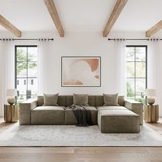 a living room filled with lots of furniture next to two large windows and wooden beams