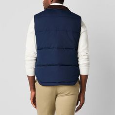 Layer up in style for cold-weather outings with this St. John's Bay men's quilted cargo puffer vest. Made from a warm material and lining, this midweight style has two front snap pockets and a full zip closure. Wear it over a sweater with jeans.Closure Type: ZipperPockets: 2 Front Snap PocketsWarmth Factor: MidweightApparel Length: 27 InchesOuterwear Length: ShortFiber Content: 100% PolyesterFabric Description: WovenFilling Content: 100% PolyesterLining: LinedLining Material: PolyesterCare: Mac… Cotton Vest For Cold Weather/winter, Winter Cotton Vest For Cold Weather, Cotton Vest Outerwear For Cold Weather, Quilted Cotton Outerwear For Outdoor Activities, Winter Utility Nylon Vest, Navy Puffer Jacket For Winter Outdoor Activities, Navy Puffer Jacket For Winter Outdoors, Blue Weatherproof Puffer Jacket For Cold Weather, Navy Winter Puffer Jacket For Outdoor