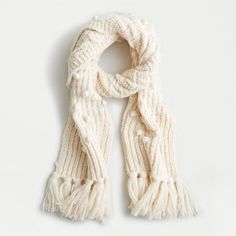 a white scarf with fringes on it