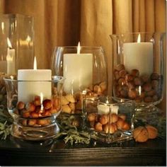 candles and nuts are arranged on a table