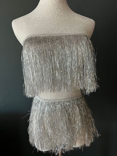 Fantastic 8" fringe with a 1cm tape for sewing. Very High quality.  Colour: Silver  Perfect for dresses, tops, dance costumes, party wear, crafting.  Available in 15 Colours.  see separate listings for colour photos.  Price Per metre (100cm / 39inches) Visit www.haberdasheryfan.com for our full range with free shipping. More unique pieces added daily! Follow us on instagram @haberdasheryfan Fringe Clothing, Fringe Fabric, Party Kleidung, Dance Bag, Suede Fringe, Silver Accessories, Dance Costume, Tassel Fringe, Silver Sequin