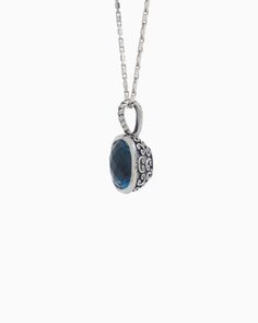 The Square Stone Pendant features a faceted London blue topaz stone set in sterling silver with a unique petroglyph texture. Take notice of the twisted detailing on the bail which adds a playful touch. Pair with your favorite chain, sold separately. Metal: Sterling silver Stone: London blue topaz Dimensions: 23mm x 14mm Stone Size: 12mm x 12mm Style #: P246LB Topaz Birthstone Jewelry With Round Stone, Sterling Silver Oval Pendant Fine Jewelry, Fine Jewelry Sterling Silver Oval Pendant, Formal Blue Topaz Oval Pendant Necklace, Topaz Oval Pendant Jewelry As A Gift, Sterling Silver Jewelry With Diamond Cut Round Stone, Oval Topaz Pendant Jewelry Gift, Topaz Oval Pendant Jewelry For Gift, Oval Topaz Birthstone Jewelry