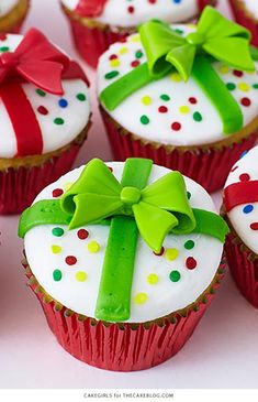 cupcakes decorated with white frosting and green bows