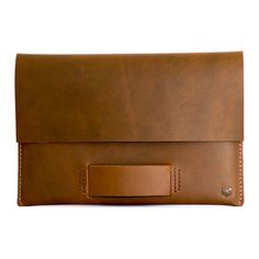 a brown leather case with a metal bar on it