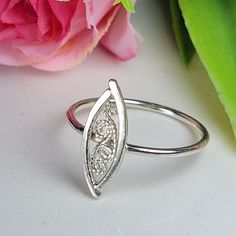 Filigree ring made by intricate metal work, creating a rich floral and dainty look. The sterling silver leaf ring is inspired by Art nouveau jewelry combined with modern design. This oval art ring is perfect for a beloved woman, and as a pampering gift for yourself. The ring is very flattering to the finger, comfortable to wear as a jewel for everyday use and impressive as a jewel for a special occasion. The structure of the ring is  approximately 12 mm long, creating an elegant and unique style. The ring is made of 925 sterling silver by hand tools only. Each piece of jewelry is handmade to order, therefor due to the special nature of handcrafting, there may be slight differences compared to the jewelry in the photos shown. This adds to the charm and individuality of each piece, making it Elegant Oval Sterling Silver Midi Rings, Elegant Oval Midi Rings In Sterling Silver, Delicate Oval Sterling Silver Rings, Handmade Sterling Silver Filigree Open Ring, Silver Oval Filigree Promise Ring, Wedding Sterling Silver Filigree Open Ring, Oval Filigree Ring Adjustable Gift, Sterling Silver Filigree Open Ring For Wedding, Sterling Silver Filigree Open Ring Hallmarked