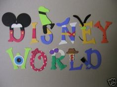 the word disney world is made out of cutout letters and mickey mouse heads on a wall