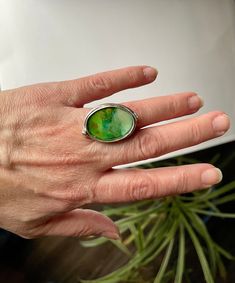 This unique statement ring has a tiny painting done in alcohol ink inside. The painting is then covered in resin for protection and shine. The ring is adjustable and made from antique silver coated brass.  Designed for wearing in the middle of the hand due to size. The bezel is about an inch long.  Great gift for an artist, someone who likes one-of-a-kind pieces, or yourself! Pink Tool Box, Pink Tools, Art Ring, Green Ring, Green Rings, Art Green, Alcohol Ink Art, Silver Coat, Gifts For An Artist