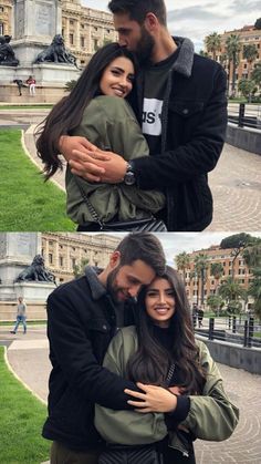 a man and woman hugging each other in front of a building with lots of green grass