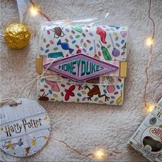 Exclusive Loungefly Harry Potter Honeydukes Candy Print Wallet Don't Forget To Make A Stop At The Wizarding Sweets Shop, Honeydukes, To Pick Up Some Sweets And Treats Before Heading Back To Hogwarts! Approximate Measures: 4 1/4" X 4" X 3/4" Exact Print Placement Varies Harry Potter Honeydukes, Honeydukes Candy, Back To Hogwarts, Every Flavor Beans, Candy Print, Loungefly Bag, Print Placement, Hogwarts, Don't Forget