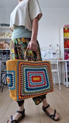 Granny Square Crochet Bag, Crochet Tote Bag in Vintage Style, Unique Gift for Women, Bag with Real Bamboo Handles I used high quality cotton yarn to make this shoulder bag. It is fully lined with cotton fabric. This handmade bag has enough space for all your belongings. Entirely handmade crochet by me after my own design.✔ This unique crochet bag can be a great gift for your loved ones and add a unique look to your style..🎁 ♥️the size is approximately 54×60 cm ♥️100% handmade ❤️real bamboo hand Multicolor Crochet Top Handle Bag For Travel, Multicolor Top Handle Crochet Bag For Travel, Yellow Square Box Bag With Top Carry Handle, Multicolor Crochet Top Handle Shopping Bag, Multicolor Crochet Top Handle Bag For Shopping, Rectangular Crochet Beach Bag With Top Handle, Multicolor Top Handle Crochet Shopping Bag, Yellow Crochet Bag With Double Handle For Shopping, Multicolor Crochet Top Handle Bag For Daily Use