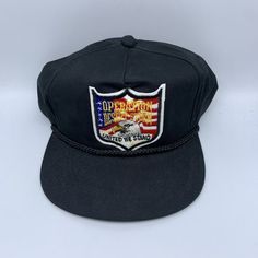 Vintage U.S Military Operation Desert Storm Yupoong Hat Snapback Cap Vintage Black Dad Hat For Streetwear, Vintage Black Baseball Cap With Flat Bill, Vintage Black Flat Bill Hat, Black Vintage Trucker Hat With Flat Brim, Vintage Black Trucker Hat With Curved Brim, Vintage Black Trucker Hat With Flat Brim, Black Vintage Dad Hat With Curved Brim, Vintage Black Flat Brim Trucker Hat, Vintage Black Baseball Cap For Outdoor