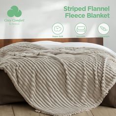 an image of a bed that is made with the comforter on top of it