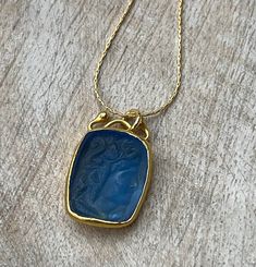 "Greek Goddess!  Handmade blue woman Intaglio pendant necklace.  Gold vermeil pendant on a gold filled chain.  Very pretty layered or worn alone,   Beautiful and classic necklace!   Necklace pictured is 17\".  Please see picture for necklace lengths prior to ordering." Elegant Blue Necklace With Coin Pendant, Gold Intaglio Necklace, Elegant Round Pendant Intaglio Necklace, Handmade Yellow Gold Necklace With Rectangular Pendant, Blue Engraved Pendant Necklace, Elegant Engraved Blue Necklaces, Blue Engraved Round Pendant Necklace, Elegant Blue Engraved Necklace, Elegant Engraved Blue Necklace