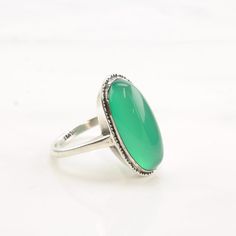 This ring is a size 9 1/2 (USA); It may be resized. Markings: Silver (Tested & guaranteed to be Sterling Silver) This ring weighs 5.7 Grams The Stone/Design is Green Chrysoprase Oval   Natural  The Stone/Design measures 22 x 10.8 mm The Ring face measures 24.5 x 13.5 mm The condition of this ring is Estate, Very good, light patina This vintage item is circa 1940  To have us do the resize, add this listing and the resize listing to your cart and select which size you would like this ring to be on the resize listing which may be accessed through this link: https://www.etsy.com/listing/780307949/simple-silver-ring-resize Stock# R4387Dor For more vintage sterling silver rings please visit:  https://www.etsy.com/shop/SilverStarrs925?section_id=13854217 Thank you for viewing my item!  Favorite t Classic Oval Chrysoprase Ring, Elegant Oval Chrysoprase Rings, Classic Green Opal Cabochon Ring, Classic Green Oval Opal Ring, Oval Cabochon Rings For May Birthstone, Oval Green Rings With Polished Finish, Green Oval Opal Ring With Polished Finish, Green Oval Opal Ring, Classic Green Cabochon Ring