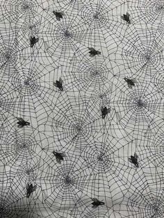 spider webs on white fabric with black dots