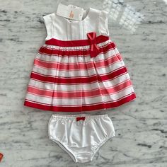 Super Sweet Red, Pink And White Striped Dress Set. The Whole Dress Is Lined And Buttons Up The Back. Has Matching Diaper Cover. This Is Part Of Mayoral's Infant Line And The Sizing Is European. They Do More Size Ranges Than We Do Here In The Us. It Goes Like This 0-1m=Newborn, 1-2m= 0-3m 2-4m= 3m, 4-6m=6m, 6-9m= 9m, And Then 12m. I Am Listing The Us Sizes. All Of My Items Come From My Children's Boutique. All Brand New And Directly From The Manufacturer. Please Feel Free To Ask Any Questions. Holiday White Cotton Sets, White Cotton Holiday Dress, Playful White Playwear Dress, White Sleeveless Playwear Dress, Cute White Dresses For Playwear, White Fitted Dress For Playwear, Pink Stripe Dress, Pink Velvet Dress, It Goes Like This