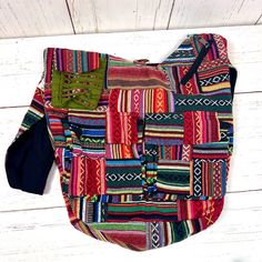 Elevate your bohemian style with our Handmade Gheri Cotton Patchwork Sling Bag, a unique and colorful accessory designed for those who appreciate artistry and functionality.Artisanal Craftsmanship: Handcrafted with care, each bag features a distinctive patchwork design using Gheri cotton, known for its durability and vibrant patterns. Multi-Pocket Design:Stay organized on the go with multiple pockets. This sling bag includes a spacious main compartment, two front pockets with Velcro closure, one Artisan Multicolor Bag With Adjustable Strap, Multicolor Bohemian Shoulder Bag For Travel, Artisan Multicolor Shoulder Bag With Adjustable Strap, Casual Green Patchwork Shoulder Bag, Multicolor Patchwork Hobo Bag For Daily Use, Multicolor Patchwork Hobo Bag For Everyday Use, Bohemian Cotton Bag With Adjustable Strap, Bohemian Multicolor Cotton Hobo Bag, Daily Use Multicolor Patchwork Hobo Bag