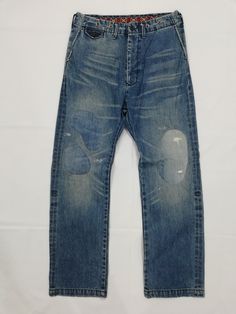 Rageblue Denim Pants Nice details including buckle back and rivets Reworked with Patchwork One of a kind! ACTUAL MEASUREMENT (Inch) Waist 16 Outseam 42.5 Inseam 30 Leg Opening 9 Rise 13 Thigh 12 CN325 NOTE 1) All items are 100% authentic. 2) All items should be WASHED before use. 3) Do not rely on tag size as pre-worn items may have been altered, stretched or shrunk. 4) The best way to ensure a correct fit is to compare our measurements with the measurements of a similar item that you know fits you well. 5) Please refer all images, and enlarge them for better details. 6) All measurements are been taken with the garment flat on the floor. 7) NO RETURN NO REFUND AFTER PURCHASE. 8) Please do not expect it to be like new as mostly are used item, unless mentioned as NEW. 9) Actual item might ha Pre-washed Straight Leg Denim Blue Jeans, Distressed Indigo Denim Jeans, Blue Distressed Rigid Denim Pants, Medium Wash Pre-washed Denim Pants, Pre-washed Denim Jeans For Streetwear, Pre-washed High Rise Denim Jeans, High Rise Pre-washed Denim Jeans, Pre-washed Blue Bottoms For Streetwear, Denim Blue Pre-washed Jeans For Streetwear