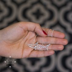 "Geometric silver shark necklace is the ultimate everyday accessory to show off your love of animals while staying in style on trend. ★This is the silver item, for the gold item use this link: https://www.etsy.com/listing/569113599 ★ Comes in our signature gift box, ready for gift giving. ★ Available in Silver [Sterling silver chain & silver plated pendant] ★ Pendant size : 2\"X0.70\" (50X18mm) ★ Handmade ★For more ocean jewelry click this link: https://www.etsy.com/shop/ByYaeli?ref=seller-p Gold Seashell Necklace, Gold Compass Necklace, Shark Jewelry, Shark Pendant, Silver Shark, Geometric Origami, Jewelry Design Studio, Shark Necklace, Ocean Necklace