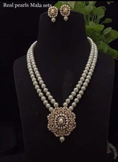 Gorgeous Long CZ Stones Necklace with Pearl in Victorian style with matching earrings Necklace length: 22 inches approx  Highest quality and craftsmanship Free shipping Since natural semiprecious beads are used in this necklace, Color and shape of the beads may vary slightly Please let me know if you have any questions Cheap Traditional Long Necklace, Luxury Dual-tone Temple Jewelry Necklaces, Luxury Silver Temple Necklace, Luxury Temple Necklace With Polished Beads For Wedding, Luxury Long Temple Necklace For Gift, Luxury Vintage Temple Necklace For Ceremonial Occasions, Luxury Antique Temple Necklace For Ceremonies, Luxury Dual-tone Temple Necklace, Pearl Necklace Designs Unique