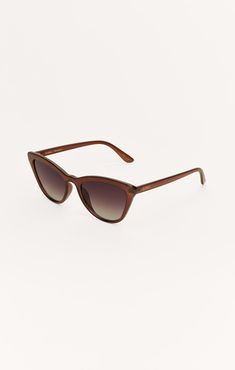 This fashion frame features a contemporary cat-eye design that fuses traditional details with modern materials and will definitely get you noticed. Casual Brown Cat Eye Sunglasses With Gradient Lenses, Brown Cat Eye Sunglasses With Gradient Lenses, Casual Brown Cat Eye Sunglasses With Tinted Lenses, Casual Brown Polarized Cat Eye Sunglasses, Casual Brown Cat Eye Sunglasses With Polarized Lenses, Brown Cat Eye Sunglasses With Glass Lenses, Casual Brown Cat Eye Sunglasses, Casual Cat Eye Sunglasses With Tinted Lenses, Brown Cat Eye Sunglasses For Beach