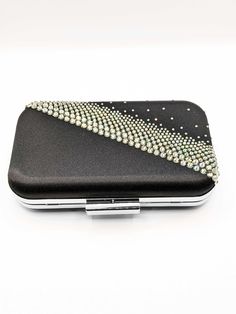 Carry your belongings in style with the ONYX clutch! This chic black clutch is perfect for your night out and that little black dress. Adorned with sparkling Austrian crystals in a diagonal pattern for a modern design. This bag is large enough to fit your phone, lipstick, keys and more. Look fashionable and feel fabulous with every entrance you make! Luxury Black Clutch With Magnetic Closure, Phone Items, Onyx Crystal, Crystal Clutch, Black Clutch, Austrian Crystal, Luxury Accessories, Ariel, Silver Chain