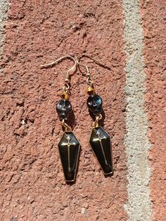 Made as a part of our Halloween and witchy collection. All metal components and fixings are made exclusively with hypoallergenic materials, making them great for sensitive skin.  Hand made in Wake Co, NC, USA. Skin Hand, Black Skull, Black Skulls, Stone Earrings, Labour Day, Sensitive Skin, Jewelry Earrings Dangle, Dangle Drop Earrings, Hand Made