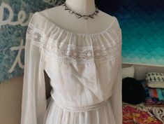 What's better than a peasant dress? A classic white one! By top-quality American maker This Is Yours, this lovely dress was made in the late 60s in soft cotton voile and lace. It has a nice long back zip, the original tie belt, and fresh elastic in the neckline.  The only flaw is a very small mend near to the right of the zipper where it looks like a necklace tore a small hole. It has been expertly repaired.  36 max bust, 27 max waist, open hips, 16 bodice, 25 sleeve, 57 total length Spring Wedding Peasant Dress, White Peasant Wedding Dress, Open Hips, Hippie Garden, Cottagecore Vintage, White Maxi Dress, 70s Boho, 60s Dress, Gunne Sax