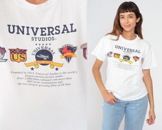 Vintage 80s t shirt in white with a Universal Studios graphic. Please see measurements and condition below. Every garment we sell is authentic vintage! You will receive the exact item photographed. Condition: Very good vintage. Best fits women's: Labelled Medium Tag: universal studios Material:  Cotton MEASUREMENTS Taken from seam to seam while the garment is lying flat. Double the armpit, waist, and hips For reference, model is 5'9" and measures 35-27.5-39. Length from Top: 24" Armpit to Armpit 80s Hollywood, California Movie, Film Studio, 1980s Vintage, Film Movie, Vintage Denim, Los Angeles California, White Vintage, How To Look Better