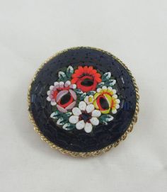 "This listing is for your choice of ONE item. When checking out, please pick which one you want ! Pick your favorite ! Elegant micro mosaic brooches with beautiful details. Some signs of wear and tarnish. Please ask for additional pictures. Accordingly to https://www.collectorsweekly.com/fine-jewelry/micro-mosaic: The term \"micro mosaic\" (also spelled \"micromosaic\" and \"micro-mosaic\") was coined by wealthy 20th-century collector Sir Arthur Gilbert in reference to Roman mosaics composed of Handmade Antique Enamel Pin For Gift, Antique Multicolor Brooches As Gifts, Antique Multicolor Brooch For Gifts, Handmade Flower Brooches For Collectors, Vintage Multicolor Enamel Pin Gift, Vintage Multicolor Round Brooches, Antique Enamel Handmade Brooches, Artistic Multicolor Brooches As Gift, Artistic Multicolor Brooches For Gift