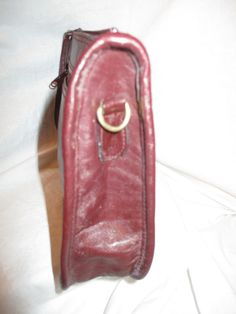 "Deep burgundy. Measures 10 3/4\" L X 2\" W X 6 1/2\" H. No designer or makers label. It has 1 exterior zip pocket. The interior has 1 zip pocket. Zip closure. The removable strap has a 17\" drop. Gold hardware. The exterior has a few light scuffs and the hardware has some tarnish. Some wear to the finish on the zipper pulls. The interior is like new. I ship same or next business day." Formal Crossbody Shoulder Bag With Zipper, Burgundy Rectangular Shoulder Bag With Zipper Closure, Burgundy Satchel With Adjustable Strap For Formal Occasions, Formal Burgundy Satchel With Adjustable Strap, Classic Burgundy Shoulder Bag With Zipper Closure, Formal Burgundy Shoulder Bag With Zipper Closure, Formal Burgundy Shoulder Bag With Zipper, Mannequin Dress, Coyote Fur