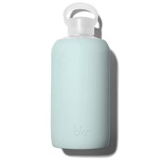 a light blue water bottle sitting on top of a white surface