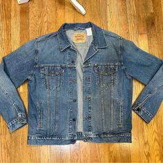 Men’s Levi Denim Jacket Never Worn. Size X-Large Levi's Washed Denim Jacket For Streetwear, Levi's Medium Wash Denim Jacket For Streetwear, Levi's Relaxed Fit Medium Wash Denim Jacket, Levi's Light Wash Outerwear For Streetwear, Levi's Relaxed Fit Denim Jacket, Classic Medium Wash Outerwear For Streetwear, Levi's Light Wash Denim Jacket With Pockets, Levi's Casual Medium Wash Outerwear, Levi's Medium Wash Denim Jacket