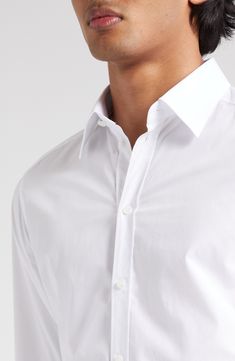 A smart wardrobe essential, this Italian-crafted shirt is cut from pure cotton poplin for a crisp look and easy movement. 30" length; 40 1/2" chest (size 40) Raised placket Point collar Long sleeves with button cuffs 100% cotton Machine wash, line dry Made in Italy Designer Clothing White Poplin Button-up Shirt, White Long Sleeve Poplin Shirt, Classic Poplin Tops With Button Cuffs, White Poplin Shirt For Work, White Poplin Shirt For Office, White Poplin Office Shirt, Classic Poplin Tops With Button Closure, Formal White Poplin Tops, White Poplin Top With Spread Collar