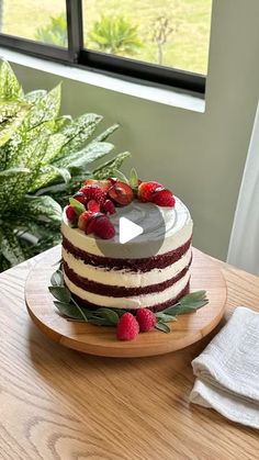 a cake sitting on top of a wooden table