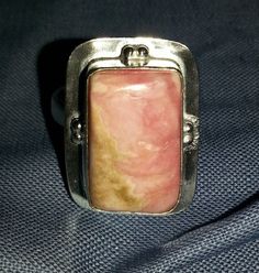 Beautiful and Rare Ring of natural Rodochrosite Gemstone in 925 sterling silver plated over solid copper. Size 8 ring. Condition: Lived a previous life & in a perfect vintage condition. Excellent condition. To see a complete listing of all the items in my shop, please click on the following link: https://www.etsy.com/shop/ReneeDawnArtfulJewel. . . . . . . . . . . . . . . . . . . . . . . . . . . . . . . . . . . . . . . . . . PACKAGING: If you purchase multiple items and need each piece in sep Sterling Silver Rings Untreated, Unique Sterling Silver Ring With Rectangular Stone, Unique Rectangular Natural Stone Rings, Unique Rectangular Gemstone Ring, Unique Rectangular Rings With Natural Stones, Silver Rings With Rectangular Natural Stones, Sterling Silver Rings With Natural Stones In Rectangular Shape, Sterling Silver Cross Necklace, Sterling Silver Cross Pendant