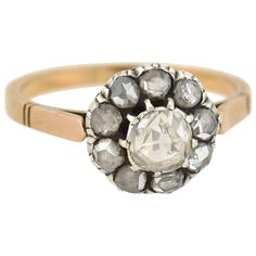 an antique diamond cluster ring, in yellow gold and white gold with old cut diamonds