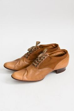 "Antique Edwardian (early) era leather walking shoes. Camel colored leather mixed with canvas. Rounded toe with stitching detail. Wooden heel. Front lace ties. A wonderful representation of attention to detail and lasting craftsmanship. State of garment | very good for age, minimal wear on soles. small repair on left shoe, refer to photos. Measurements ✂--- best fit | Modern 5 1/2 N - 6 N * please refer to measurements below length | 9.5\" width | 2.75\" label | 3 1/2 E ★★Visit The Shop★★ http:/ Vintage Brown Lace-up Shoes With Rubber Sole, Retro Brown Leather Lace-up Shoes, Brown Leather Oxford Shoes With Rubber Heel Cap, Brown Oxford Leather Shoes With Rubber Heel Cap, Vintage Closed Toe Oxfords With Rubber Sole, Leather Closed Toe Lace-up Shoes, Brown Almond Toe Lace-up Shoes With Rubber Heel Cap, Vintage Formal Oxfords With Laces, Vintage Oxfords For Formal Occasions