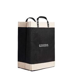 a black and white shopping bag with the words goods printed on it's side