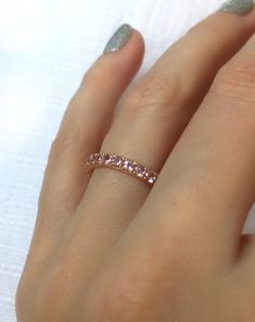 Light Pink Sapphire Eternity Ring 2.5mm 1 to 2 ctw . Half 3/4 Full Eternity 18k 14k Gold . Stacking Ring . Wedding Band . Yellow White Rose Light pink Madagascan Sapphires set in solid 18 or 14k gold. These sapphires were hand selected for their amazing sparkle and beautiful tone. A delicate pink but with an intensity that gives them real impact. Madagascan sapphires really have the best hues for these light colored sapphires. The sparkle is also intense. They catch the light beautifully. These Pink Wedding Band, Sapphire Eternity Ring, Gold Stacking Ring, Ring Wedding Band, Rose Gold Wedding, Fine Jewelry Designers, Jewelry Ring, Stacking Ring, Ring Wedding