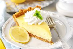 a slice of lemon pie on a plate with a fork