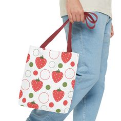 This playful bag features an eye-catching red strawberry design, adding a touch of fun to your everyday routine. Perfect for any adventure, this tote is sure to be your new favorite accessory. Available in 3 sizes to add both functionality and style, these tote bags come with multiple handle colors to match your designs. Made with spun polyester, these bags feature double-stitched seams, cotton webbing straps, and nonwoven laminate lining for high-end durability. .: Made with 100% polyester, a m Casual Red Canvas Bag, Casual Red Canvas Bag With Adjustable Strap, Casual Bags As Gifts, Trendy Red Canvas Gift Bag, Red Eco-friendly Canvas Shopping Bag, Playful Red Bag For Gift, Casual Bags With Adjustable Strap As Gift, Casual Bags With Adjustable Strap For Gift, Casual Red Tote Bag