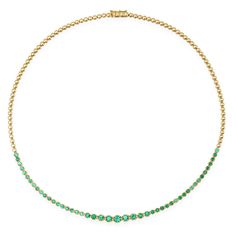 An updated take on a timeless piece, our Graduated Emerald Tennis Necklace is handcrafted in 18-karat yellow gold and set with 2.75 carats of round, brilliant cut emeralds in varying size - with the largest stones set in the center and gradually get smaller until they meet the plain, polished gold bezels that comprise Collection Letter, Tennis Necklace, Gift Card Shop, Stone Settings, Ring Bracelet, Men Necklace, Favorite Things Gift, Round Brilliant, Timeless Pieces