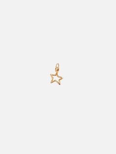 For the daydreamers. Shoot for the stars in this mini star charm. Wear this on Mandy Reid's signature Paperclip chain next to your favorite initial. Solid 14k gold Charm measures 1/2" in height Made in New York Shoot For The Stars, Authentic Jewelry, Shooting Stars, Star Charms, Gold Charm, Paper Clip, Im Not Perfect, Yellow Gold, Stud Earrings