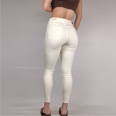 Brand New, No Flaws! Hit Refresh On White-Jeans Season In These High-Waisted, Snowy Skinnies Raw-Cut To Hit Right At The Ankle. High Waisted Raw Hem Stretchy Zip Fly With Button Closure Measurements: Inseam: 26” Waist: 14” Rise: 11” Hip: 17” Model Measurements: | Height 5’7” | Bra Size 34b | Waist 28” | Hips 36” Trendy Mid-rise Winter Bottoms, Trendy White Winter Bottoms, Beige Stretch Jeans Casual Style, Casual Stretch Beige Jeans, Beige Stretch Casual Jeans, Chic Winter Bottoms For Everyday, Chic Mid-rise Cream Jeans, High-waisted Beige Winter Bottoms, High Waist Beige Bottoms For Winter