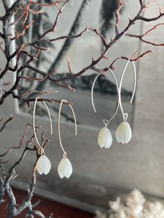 "Hawaiian Mother of Pearl Pikake and 14K Gold Filled or 925 Silver dangle earrings Super popular bridesmaid and wedding gifts for friends and family. *1.75\" long *Pierced ear - simple V hook earrings *Lightweight: 2 ounces *Material: Natural White mother of pearl Pikake and 925 Sterling Silver hook or 14K Gold filled hook The White Mother of Pearl is iridescent and reflects light when you move it around. Really high quality. Handmade with Aloha by me. Mahalo and enjoy!" Delicate Dangle Flower Earrings For Bridesmaids, Delicate White 14k Gold Filled Earrings, White Sterling Silver Threader Earrings, Delicate Earrings For Mother's Day, Delicate Nickel-free White Jewelry, Delicate White Nickel-free Jewelry, Delicate White Sterling Silver Earrings, White Hypoallergenic Earrings For Bridesmaid Gift, Delicate White Jewelry For Bridesmaid Gift