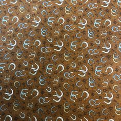 an abstract background with blue and gold swirls on brown paper that is slightly overexposed