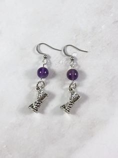 These earrings are the perfect accessory to show your love for the Greek gods in a subtle way! Made with genuine amethyst gemstone and a wine glass with grapes charm. Made with fishhook style earrings. I offer both a standard and hypoallergenic option for the hooks. The standard is stainless steel and the hypoallergenic is 925 sterling silver plated. Ships in a jewelry box so it's ready to be give as a gift. All materials are lead and nickel free. Charm is made with zinc alloy. Earrings will be Greek Mythology Earrings, Dionysus Jewelry, God Greek Mythology, Greek Birthday, Greek Mythology Jewelry, The Greek Gods, Goddess Gifts, Mythology Jewelry, Pagan Gods